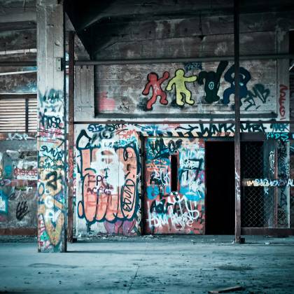 Colorful Graffiti Art On The Walls Of An Abandoned Building, Showcasing Urban Street Art Culture.