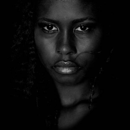 An Intense Black And White Portrait Highlighting The Emotions Of A Woman.