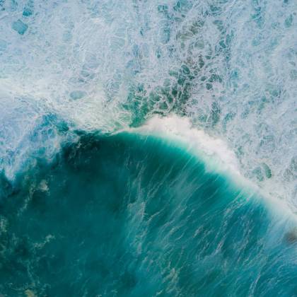 Stunning Aerial Shot Of Turquoise Ocean Waves Crashing In Tamarama, NSW.