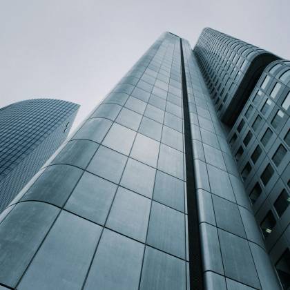 Low Angle View Of Modern Skyscrapers With Glass And Steel Design. Perfect For Corporate Imagery.