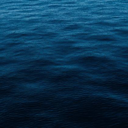 Vivid Depiction Of Deep Blue Ocean Surface, Perfect For Backgrounds And Wallpapers.