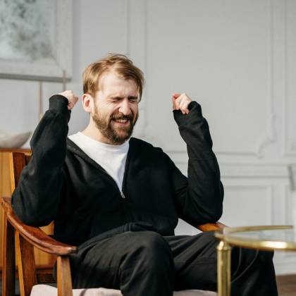 A Bearded Man Expressing Emotional Distress In A Modern Interior Setting, Seeking Mental Health Support.