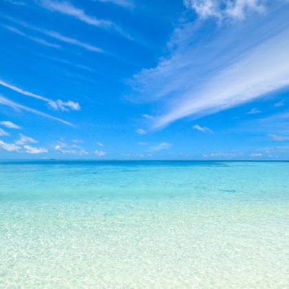 Experience The Tranquil Turquoise Waters And Clear Sky At Laamu Atoll, Maldives. Perfect For A Relaxing Getaway.