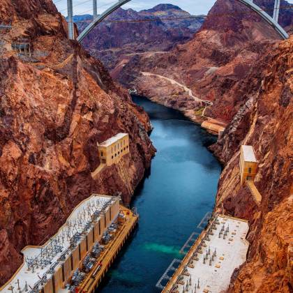 A Picturesque Landscape Of The Hoover Dam With The Mike O'Callaghan–Pat Tillman Memorial Bridge Looming Overhead.